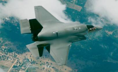 Image of a fighter jet flying above mountains