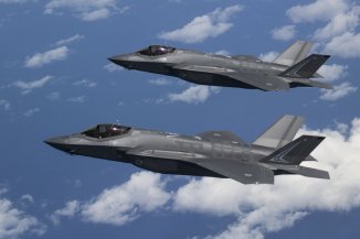 Two Joint Strike Fighter jets in the sky