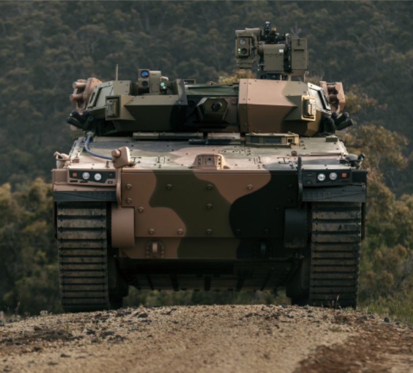 camouflage military tank in the bush