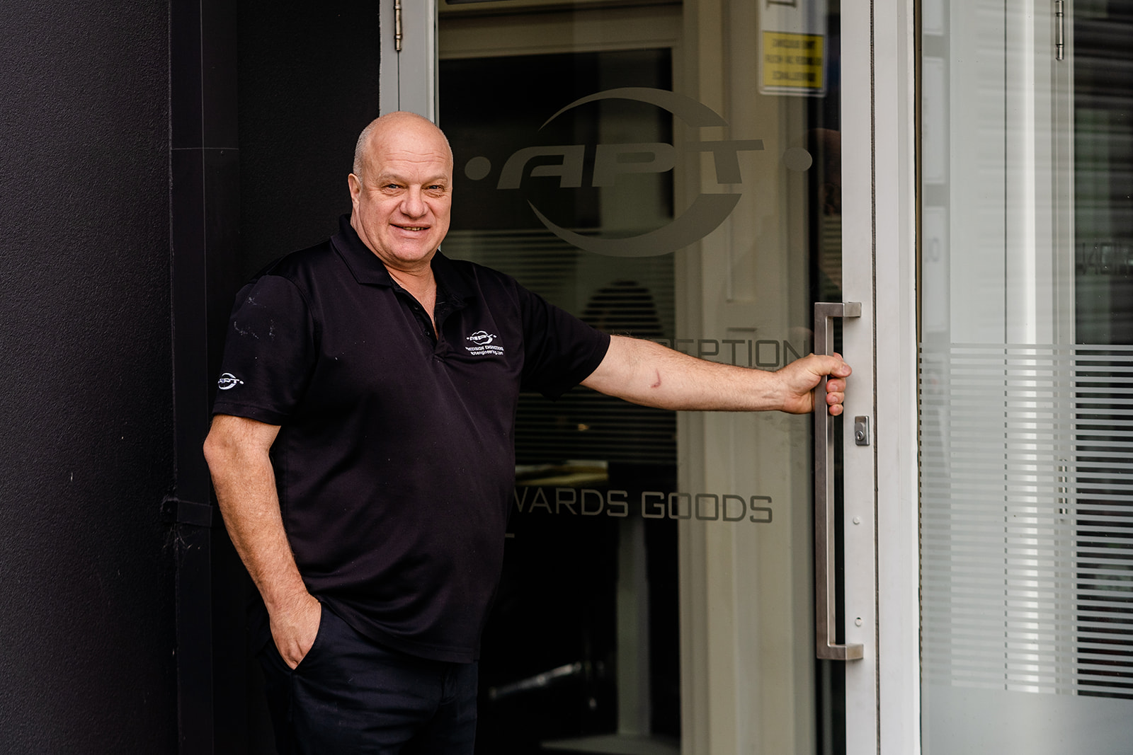 man in front of APT workplace